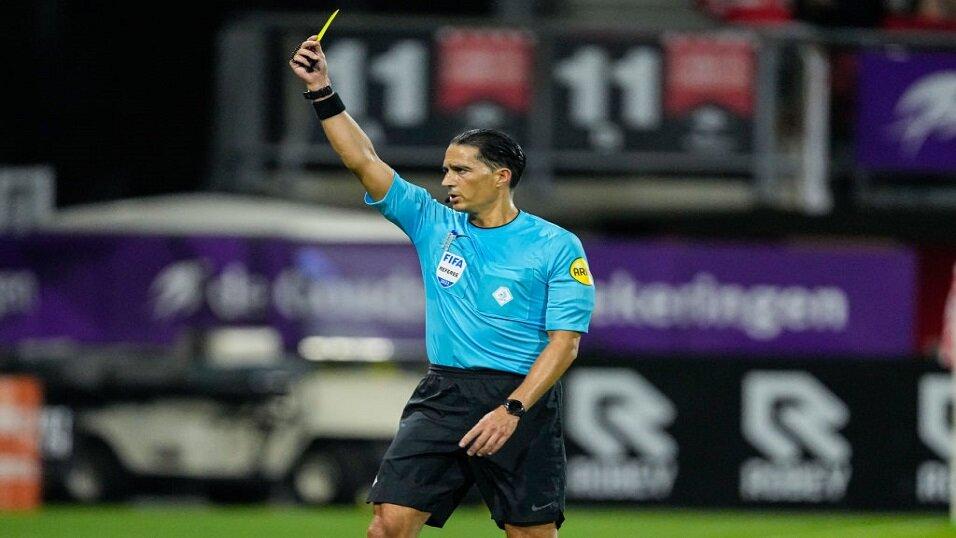 Referee shows yellow card